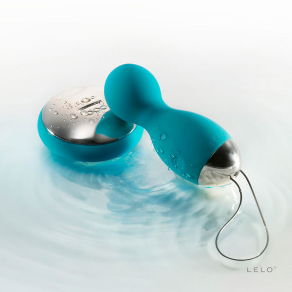 LELO Insignia Hula Blue Kegel balls displayed on a soft surface, showcasing their elegant design and smooth texture.