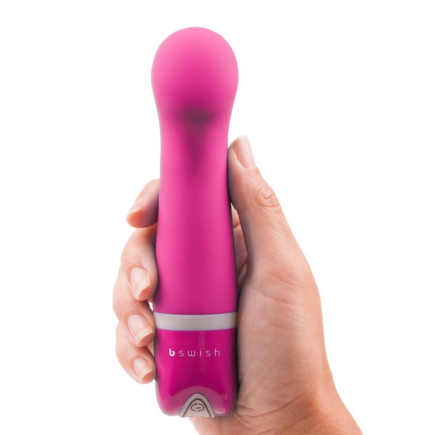 B SWISH Bdesired Deluxe Curve Rosa, a curved pink silicone personal massager with a sleek design and ergonomic shape.