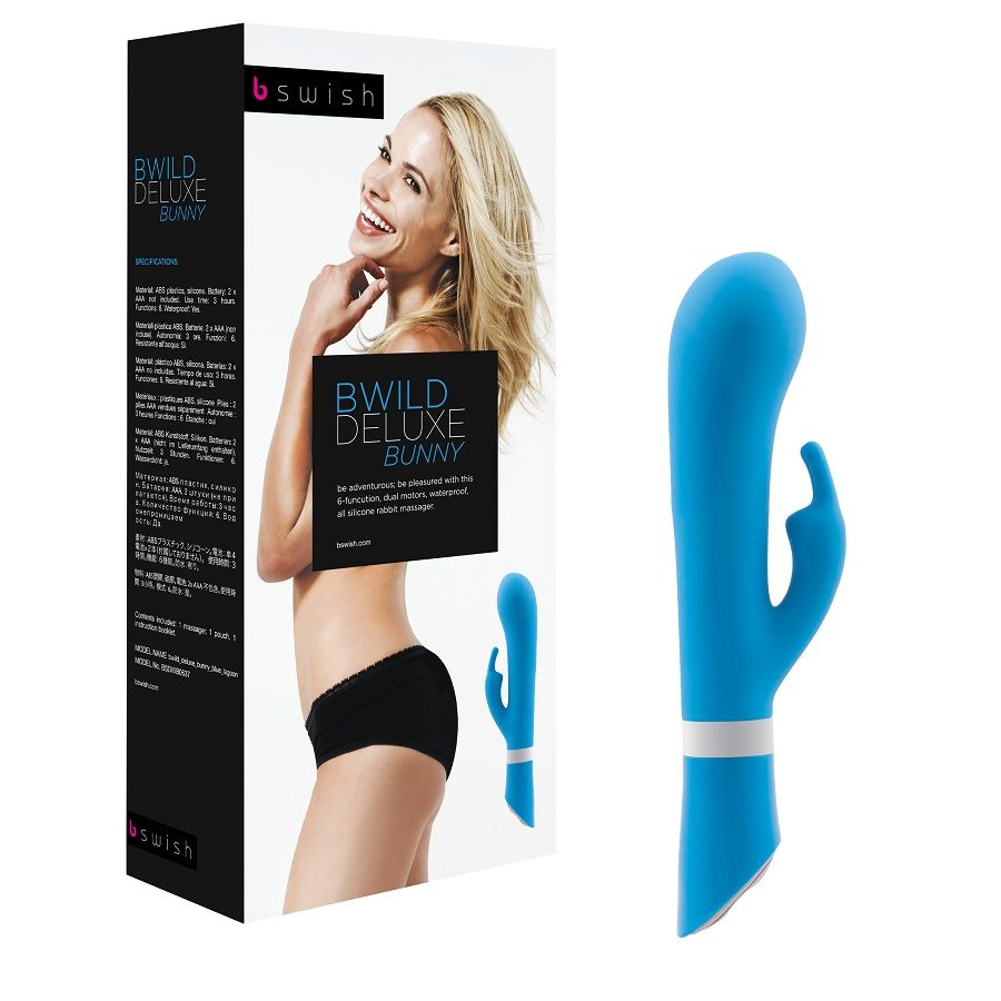 B SWISH BWILD Deluxe Bunny Rabbit Vibrator in jade with curved design and ears for stimulation, set on a soft background.