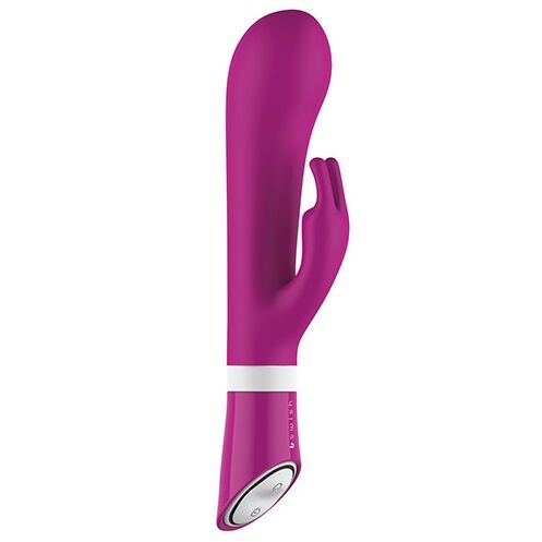 B SWISH BWILD Deluxe Bunny Rabbit Vibrator in Raspberry, featuring a sleek design and soft, textured ears for stimulation.