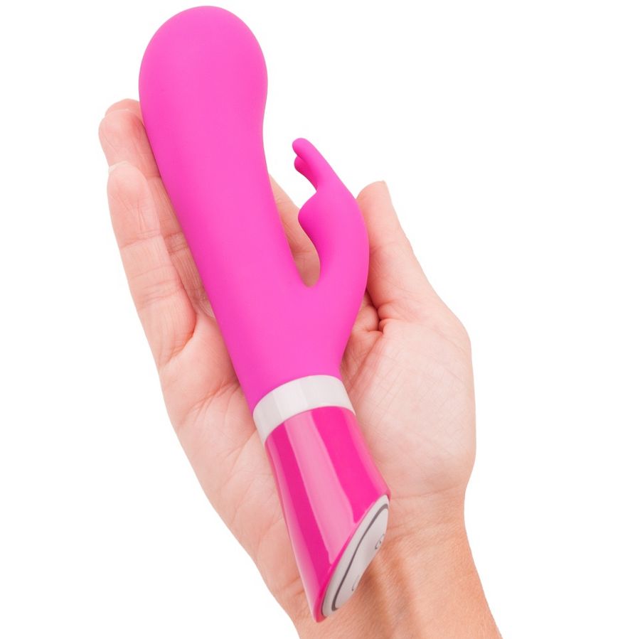 B SWISH BWILD Deluxe Bunny Rabbit Vibrator in Raspberry, featuring a sleek design and rabbit ears for targeted stimulation.