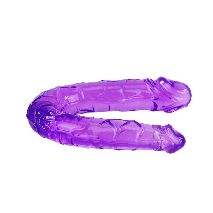 Dildo doble en gelatina flexible de color lila de la marca BAILE ANAL, con textura suave y diseño ergonómico para placer.