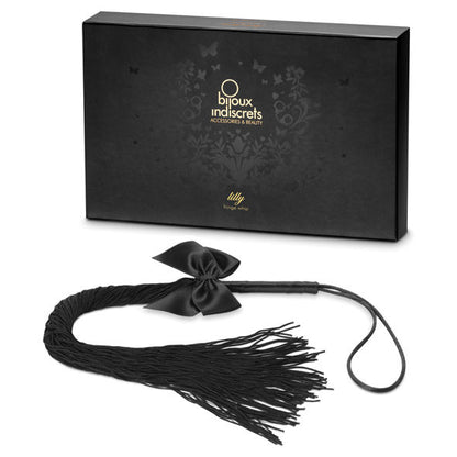 BIJOUX INDISCRETS LILLY leather fringed whip with intricate detailing and textured handle, perfect for playful moments.