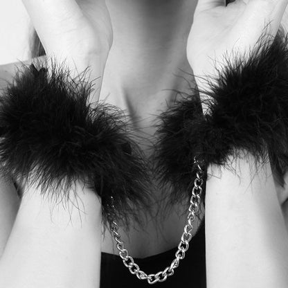 BIJOUX INDISCRETS feather handcuffs with delicate feathers and elegant design, perfect for playful restraint accessories.