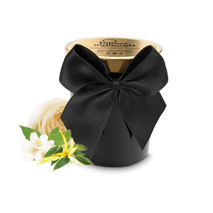BIJOUX LOVE COSMETIQUES Melt My Heart scented massage candle with aphrodisiac properties, displayed in a serene setting.