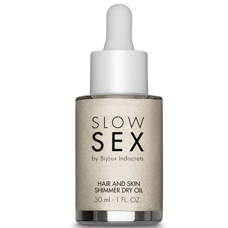 BIJOUX SLOW SEX dry illuminating multifunction oil bottle, 30 ml, with a sleek design and product label visible.