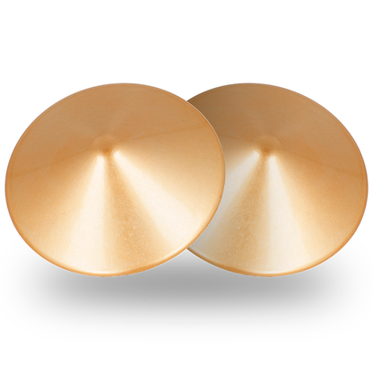Cubre pezones metálicos con círculos dorados de Coquette Accessories, diseño chic y elegante para accesorios de moda.