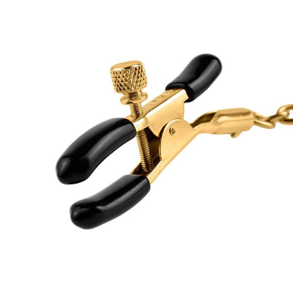 FETISH FANTASY GOLD nipple clamps with adjustable tension and gold accents on a soft background.