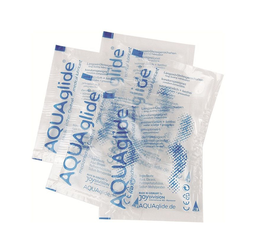 JOYDIVISION AQUAGLIDE water-based lubricant in a 3 ml monodose packet, featuring a clear liquid and sleek packaging.