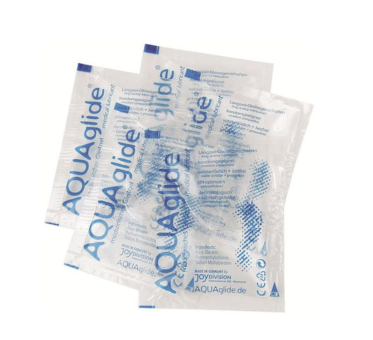 JOYDIVISION AQUAGLIDE water-based lubricant in a 3 ml monodose packet, featuring a clear liquid and sleek packaging.