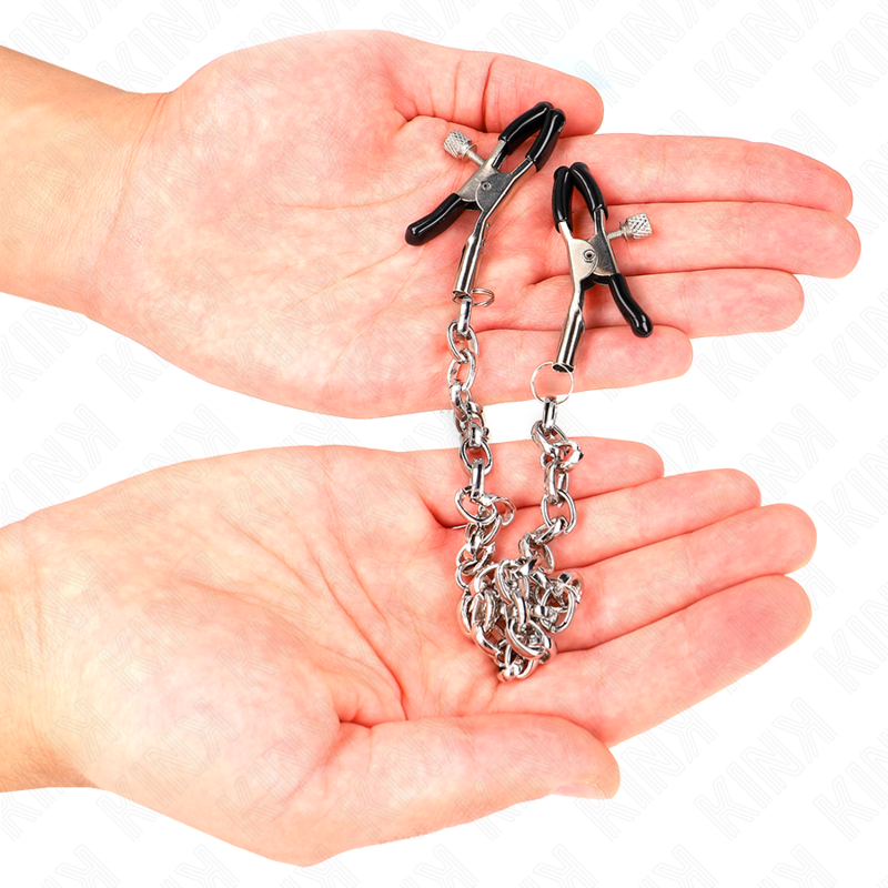 Pinzas para pezones KINK NIPPLE GRIP con cadena gruesa de 30 cm, hechas de metal, diseñadas para estimulación y restricción.