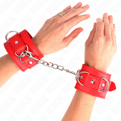 Muñequera ajustable KINK con 3 anillas en rojo, material resistente, tamaño 17.5-25 cm x 6 cm, para restricción y juego.