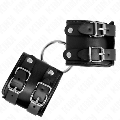 Muñequera fija de la marca KINK con anilla y tachuelas negras, ajustable de 17 a 22 cm, tamaño 6.5 cm.