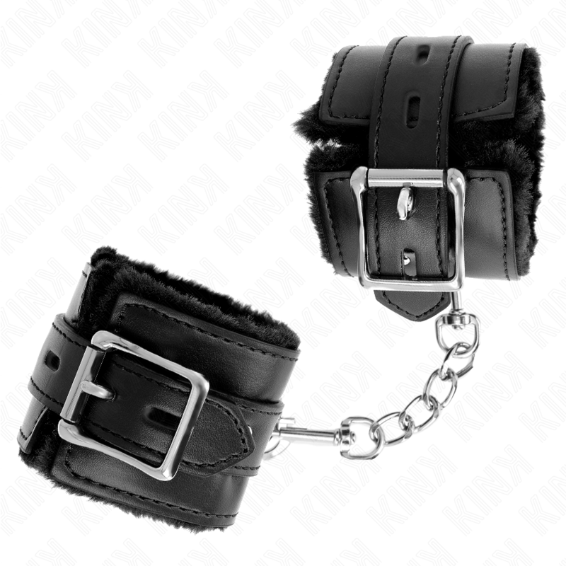 Muñequera forrada con agujeros cuadrados y correa ajustable negra de la marca KINK, resistente y cómoda, medida 17-29 cm x 6 cm.