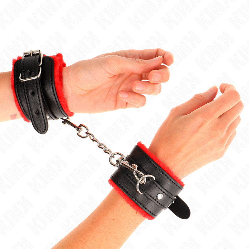Muñequera forrada roja KINK con correa negra ajustable, tamaño 17-29 cm, resistente y cómoda para restricción de muñecas.