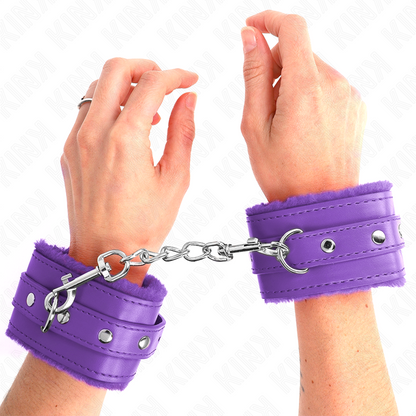 Muñequera forrada premium KINK de color violeta con correa ajustable de 17 a 29 cm y 6 cm de ancho.