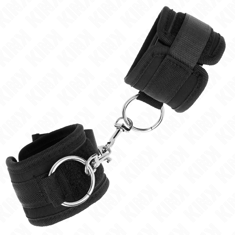 Muñequera ajustable KINK en color negro, de 18-35 cm de longitud y 6 cm de ancho, con cierre seguro y cómodo.