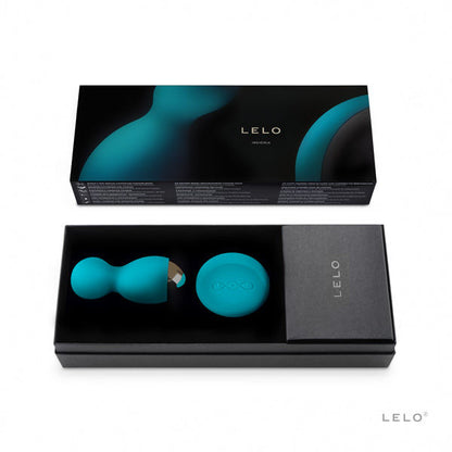 LELO Insignia Hula Blue Kegel balls on a soft surface, showcasing their elegant design and smooth texture.