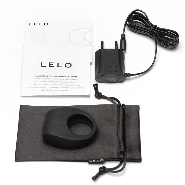 LELO TOR II black vibrating ring displayed on a soft surface, showcasing its sleek design and smooth texture.