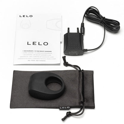 LELO TOR II black vibrating ring displayed on a soft surface, showcasing its sleek design and smooth texture.
