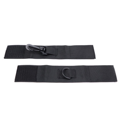 Pair of black nylon wrist restraints from OHMAMA FETISH, designed for bondage and playful restraint use.