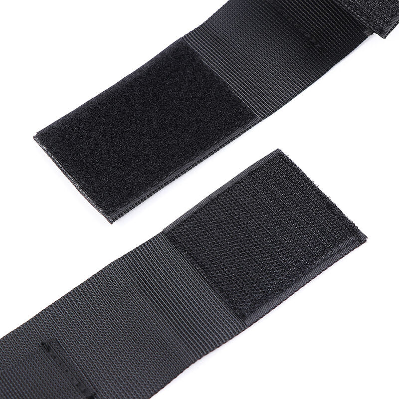 Pair of nylon wrist cuffs from OHMAMA FETISH, adjustable bondage restraints with metal hardware for BDSM role-play.