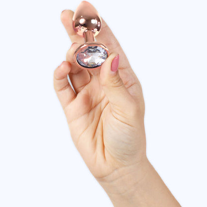 Plug anal de metal rosa oro de SECRETPLAY, tamaño S, 7 cm, con forma ergonómica y superficie lisa para placer seguro y cómodo.