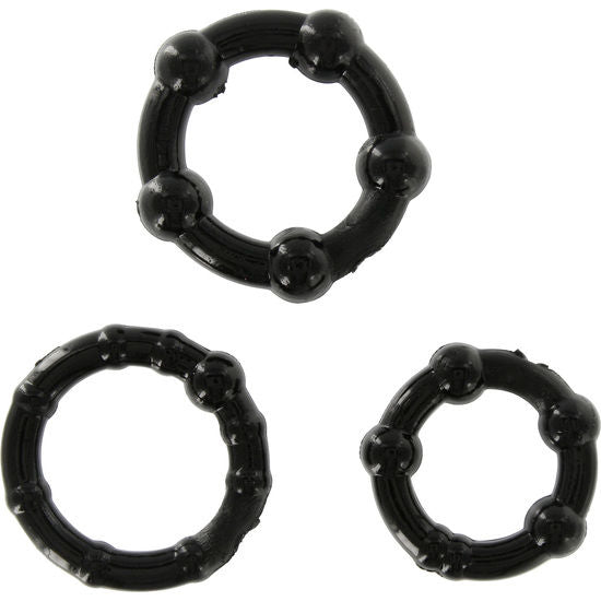 Anillo pene negro de tres piezas de la marca SEVEN CREATIONS, visible en la imagen, diseñado para estimulación y placer.