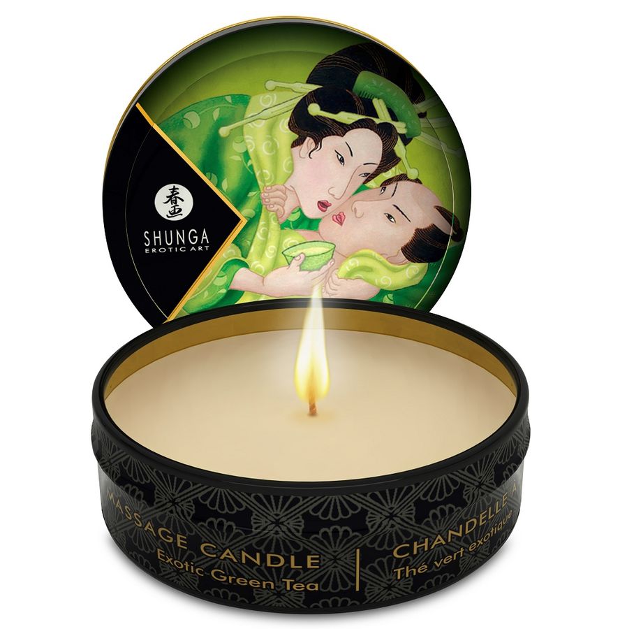 SHUNGA Mini Caress by Candlelight, green tea massage candle in a 30 ml container with a warm glow.